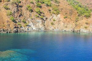 View on summer coastal landscape with clean blue sea and majestic mountains. Cirali, Antalya Province in Turkey. photo