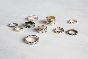 Handcraft elegant silver rings. Elegant jewelry on a soft white background. photo