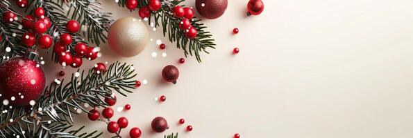 A Christmas background copy space with red berries and gold balls photo