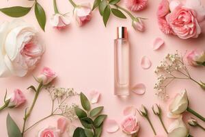 Perfume bottle surrounded by pink and white flowers on pastel background photo