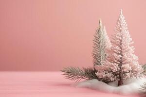 un rosado Navidad invierno antecedentes con dos pequeño blanco arboles en mesa foto