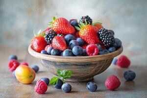Rustic bowl filled with an assortment of juicy berries and fruits photo