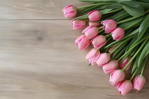 Elegant pink tulips bouquet on rustic wood, perfect for springtime decor photo