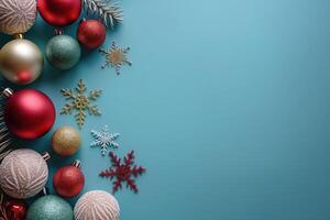 Christmas decor with colorful balls and snowflakes on blue background photo