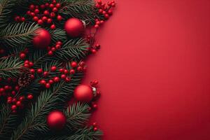 Festive red Christmas background with holiday ornaments, pine branches, and holly berries photo