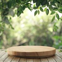 A wooden round table scene with a leafy background photo