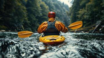 Rear view of a kayaker paddling through forest river rapids photo