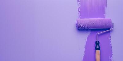 Fresh purple paint on wall with roller photo