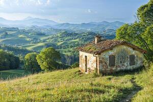 Idyllic rustic cottage overlooking scenic hills at sunset photo