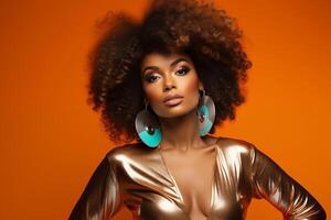 Glamorous woman with afro on orange backdrop photo