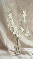 Delicate Blossoms in Vase on Linen photo