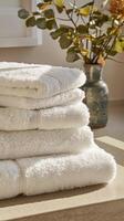 Stacked Spa Towels with Greenery photo