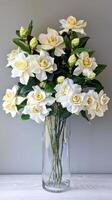 White Gardenias In Transparent Vase photo