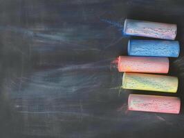 Colorful Chalk on Dark Board photo