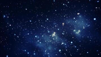 Deep blue starry background with diffused celestial light and cosmic haze photo