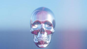 a shiny metal skull on a blue background video