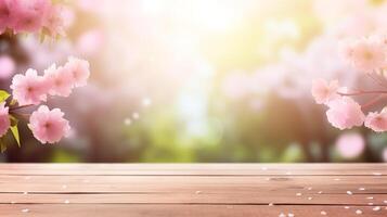 Wooden table background with copy space and a dreamy cherry blossom overlay photo