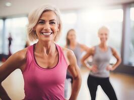 Smiling middle-aged woman confidently posing at a dance class in a well-lit studio photo