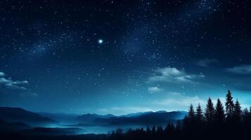 Mystical night sky background with stars over silhouetted pine trees and mountains photo