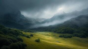 Mystical mountain landscape with fog rolling over green meadows photo