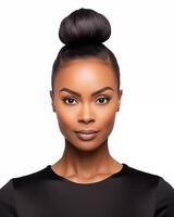 Portfolio shot of a confident African American woman with elegant top bun and black outfit photo