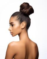 Profile view portfolio shot of mixed race woman with a bun hairstyle photo