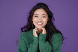 Confident Asian woman in green sweater smiling beautifully. photo