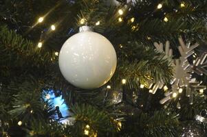 Christmas background - white ball and baubles and evergreen fir branches photo