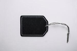 black price tag on the white background, black mockup photo