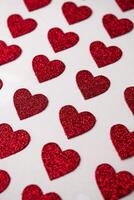 red heart shapes on the white background in valentine's day photo