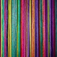 multi colored wooden craft sticks, colorful background photo