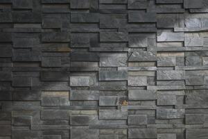 Sunlight and shadow on surface of gray stone slate wall background in vintage tone style photo