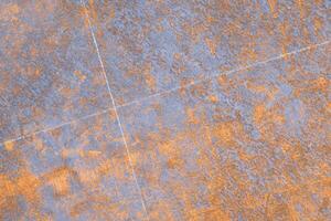 The old rust and oxidized metal panel background with white marking lines for cutting on surface photo