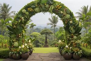 Beautiful tropical green jungle wedding arch decoration with exotic flora and lush foliage photo