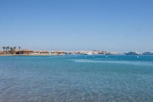 Beach Relaxation at the Red Sea. Fairy-tale Moments of a Sunny Day. The concept of tourism and sea travel photo