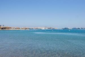 Beach Relaxation at the Red Sea. Fairy-tale Moments of a Sunny Day. The concept of tourism and sea travel photo