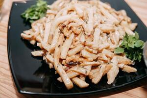 Preparing a side dish of celery root in a cooking class. Cooking at home, home-cooked food photo