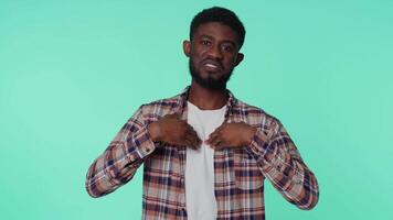 African american man feeling very proud pointing himself looking self-confident overjoyed by success video