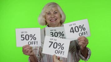 Grandma showing sale percent discounts advertisement inscriptions banners. Black Friday concept video