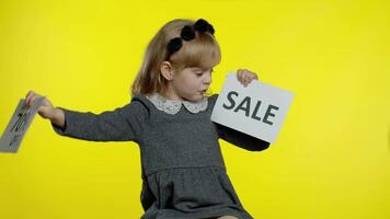 Child kid showing Sale and Up To 70 Percent Off discount advertisement banners. Black Friday concept video