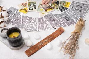 TVER, RUSSIA - FEBRUARY 18, 2024. Tarot cards, Tarot card divination, fortune telling. Occultism, esoteric education. photo