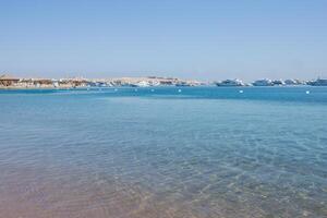 Beach Relaxation at the Red Sea. Fairy-tale Moments of a Sunny Day. The concept of tourism and sea travel photo