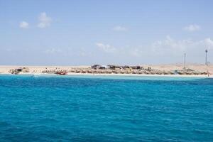 Beach Relaxation at the Red Sea. Fairy-tale Moments of a Sunny Day. The concept of tourism and sea travel photo