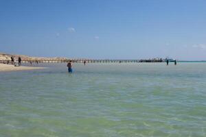 Beach Relaxation at the Red Sea. Fairy-tale Moments of a Sunny Day. The concept of tourism and sea travel photo