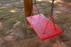 wooden and metal playground swing photo