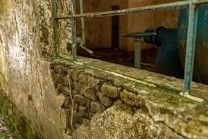 Old metal window from an abandoned building photo