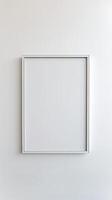 Empty White Frame on a Plain Wall photo