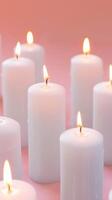 Candles On Pink Background photo