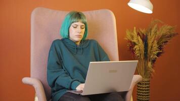 Tired young woman at laptop. video