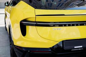 Minsk, Belarus, April 17, 2024 - Rear view luxury yellow Lotus Eletre photo